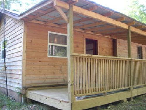 new cedar siding and new full length covered front porch